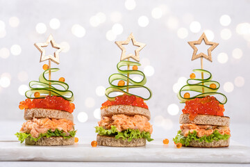 Christmas tree canape with Smoked Salmon, Cream Cheese, Dill, Horseradish Pate and red caviar