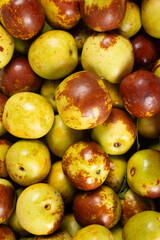 fresh jujubes at vertical composition as background