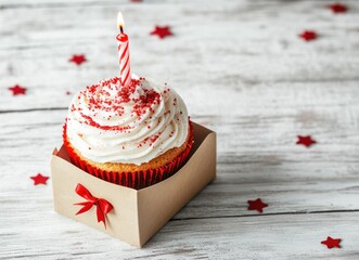 Celebratory Cupcake with a Lit Candle on a Festive Background Image
