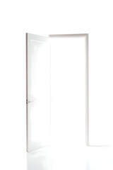 An open white door in a white room casting a soft glow with a silver handle and frame detail visible