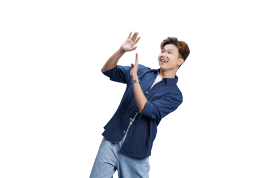 Surprised Man in Casual: A young man exhibits pure amazement and delight with both arms raised, attesting to his enthusiasm. This vibrant photo speaks of positive feelings