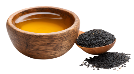 Rustic wooden cup filled with golden oil next to black cumin seeds
