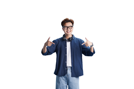 Young Man's Confidence: A youthful man, radiating confidence, gestures towards himself with a warm smile. This image speaks of self-assuredness, personal style, and a friendly demeanor.