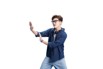 Energetic young man with headphones: A dynamic young man with glasses strikes a pose with outstretched arms. The man exudes a vibrant energy, his headphones adding a touch of modern flair.