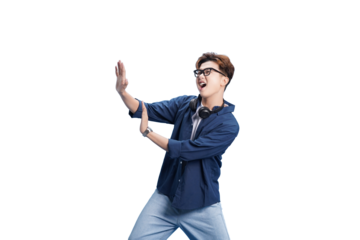 Modern Man in Motion: A dynamic young man with a pair of headphones strikes a pose of confidence and creativity, framed with a sense of excitement.