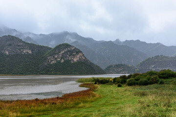 mountain landscape with lake and mountains