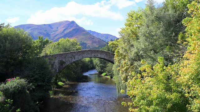 France, Pyrenees-Atlantiques, Basque Country, Saint-Etienne de Baigorry, Roman bridge spanning the Nive River. High quality 4k footage
