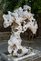 Taihu rock ornaments in a traditional Chinese garden courtyard.