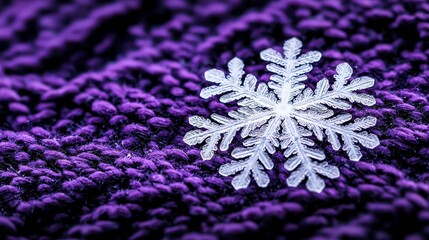 Intricate snowflake resting on a cozy purple knitted backdrop, capturing the essence of winter's beauty