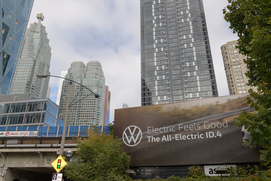 looking north on Yonge St with roadside billboard advertising The Volkswagen ID.4, a fully electric compact SUV, Toronto