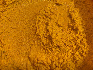 Vibrant Golden Texture Close-Up of Turmeric Powder