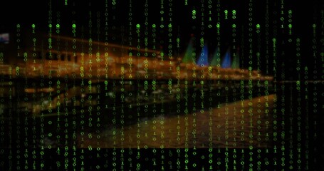 Streaming green binary code flowing across night waterfront skyline, with blurred water reflections