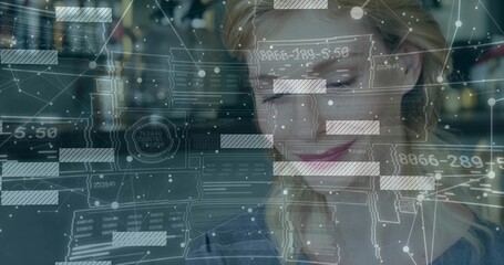 Analyzing female data analyst interacting with holographic data overlays at modern office desk