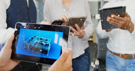 Holding tablets colleagues collaborating over digital overlay at office, with 3D wireframe model