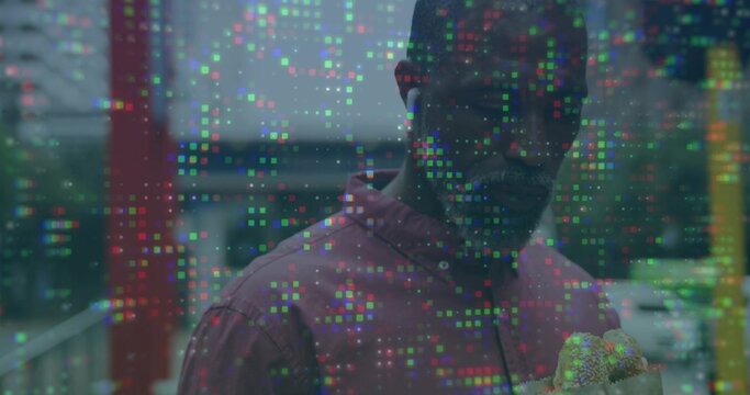 Showing African American man wearing hoodie holding potted plant on balcony railing, pixel overlay