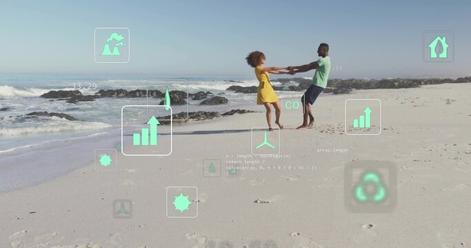 Spinning couple holding hands on sandy beach at water's edge, with waves and floating eco icons - Powered by Adobe