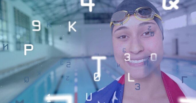 Smiling swimmer wearing cap and goggles at pool edge, with flag towel, digital overlay, copy space