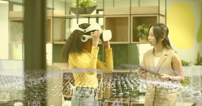 Testing man wearing virtual reality headset engaging in modern office space, with tablet and plants
