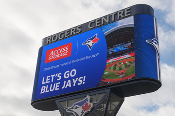 Fototapeta premium Access Storage ad and Toronto Blue Jays sponsor displayed on the Rogers Centre Gardiner LED Pylon, Toronto
