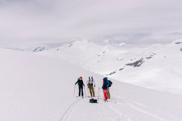Skiers enjoy a backcountry tour in the Northern Rockies of British Columbia, Canada.