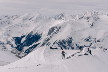 Skiers enjoy a backcountry tour in the Northern Rockies of British Columbia, Canada.
