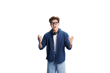 Fototapeta premium Young Man's Expression: A young man with glasses and headphones, displays a look of shock, surprise, or disbelief, his hands raised in a gesture of emotion.