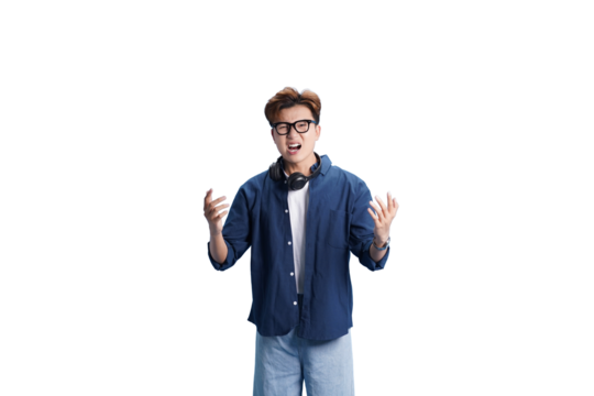 Young Man's Expression: A young man with glasses and headphones, displays a look of shock, surprise, or disbelief, his hands raised in a gesture of emotion.