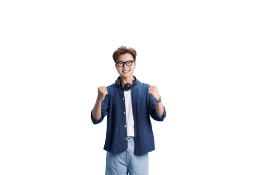 Pure Confidence: A young man radiates confidence and enthusiasm, flashing a bright smile and clenching fists, signifying achievement and empowerment.