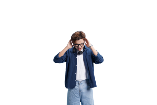 A Moment of Reflection: A young individual, immersed in thought, adjusts his headphones while gazing downwards. This image encapsulates a moment of introspection.