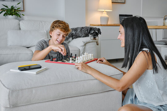 Family chess game in a cozy living room setting