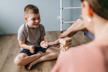 Family playing together at home with blocks