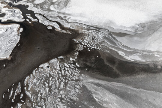 Monochrome salt texture with fluid abstract forms