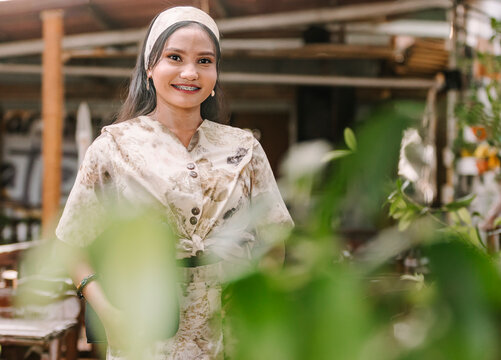 Muslim woman in eco-print dress showcasing culture