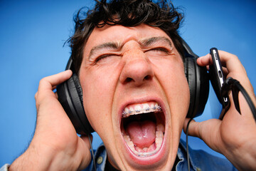 Young person enjoying music with headphones