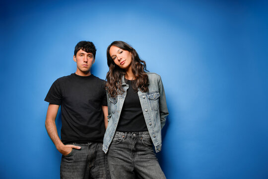 Young people with casual fashion on blue background