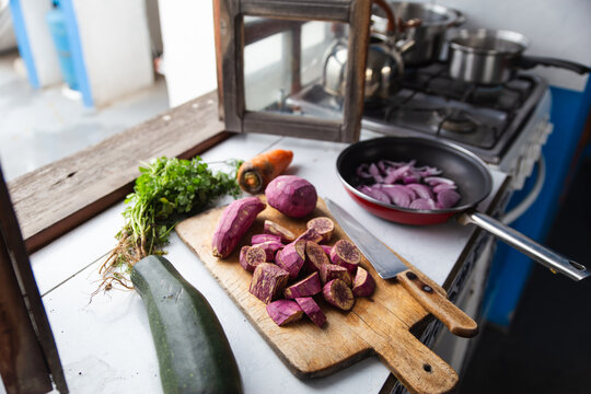 Freshly chopped vegetables on a wooden cutting board