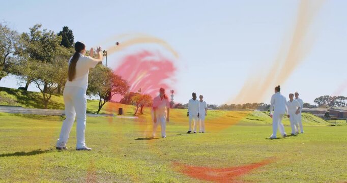 Thrower throwing underhand red ball to teammates in sports drill following animated swirl around it