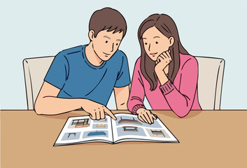 Young Couple Consult Catalog see to purches furniture