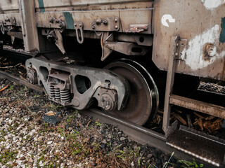 A railway carriage that derailed on a sunny day. An accident on the railroad. Derailment of railway wagons. As a result of the train accident, the train derailed. A derailed carriage.  