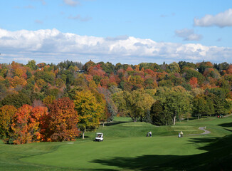 Golf course with colorful fall foliage