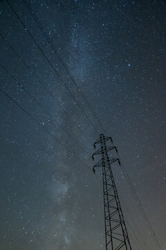 Starry sky with Milky Way and power tower