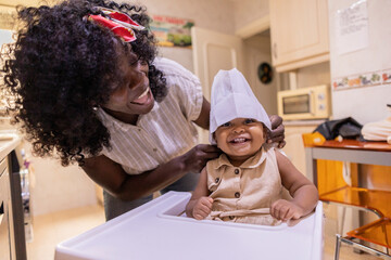 Mother and daughter sharing joyful moments at home