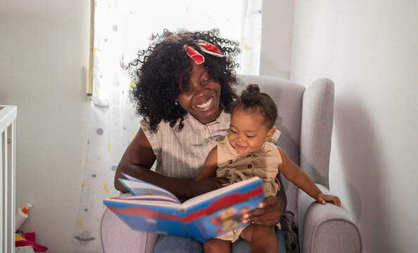 Mother and daughter enjoy reading together at home