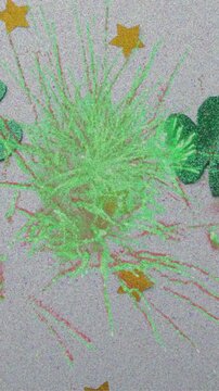 Animation of fireworks over clovers and stars
