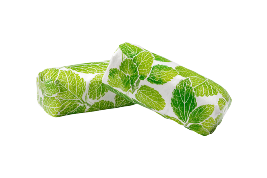 Two green leaf patterned candy bars on a black background