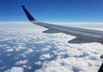 Obraz premium View from airplane window showing wing and clouds in the sky