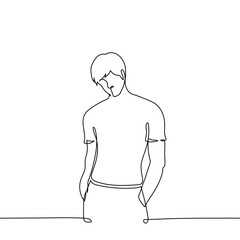 muscular, slender man stands in a tight T-shirt with his hands in his pocket - one continuous line isolated on white. A handsome man or athlete stands
