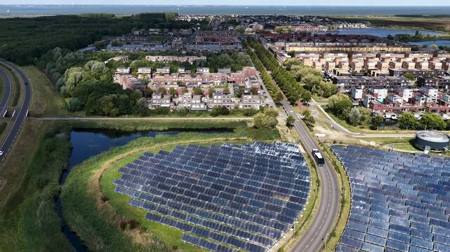 Almere, Flevoland, Netherlands - 5th of Sewptember 2025; Aerial photograph of Zonnepark Almere, Netherlands, with the Noorderplassen West Almere district in the background.