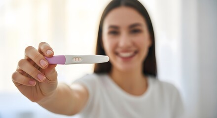 Illustration of happy young woman holding a positive pregnancy test with two lines, smiling at the camera, excited about expecting a baby