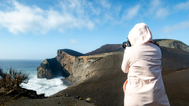 Photographer capturing Vulcao dos Capelinhos landscape